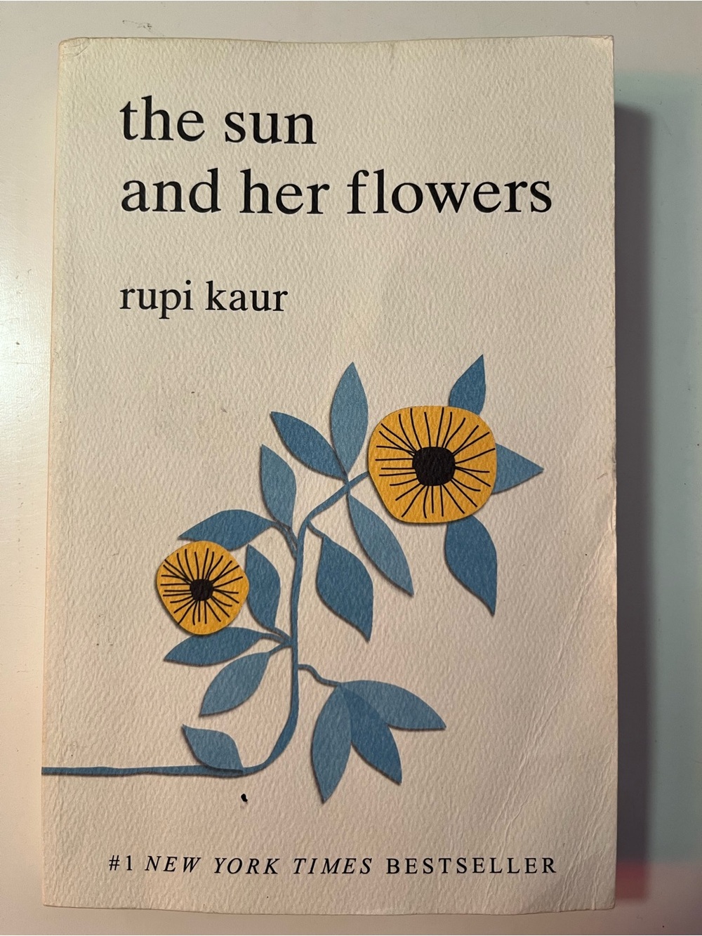 The Sun and Her Flowers by Rupi Kaur — Cream Cover with Blue & Yellow Floral Art